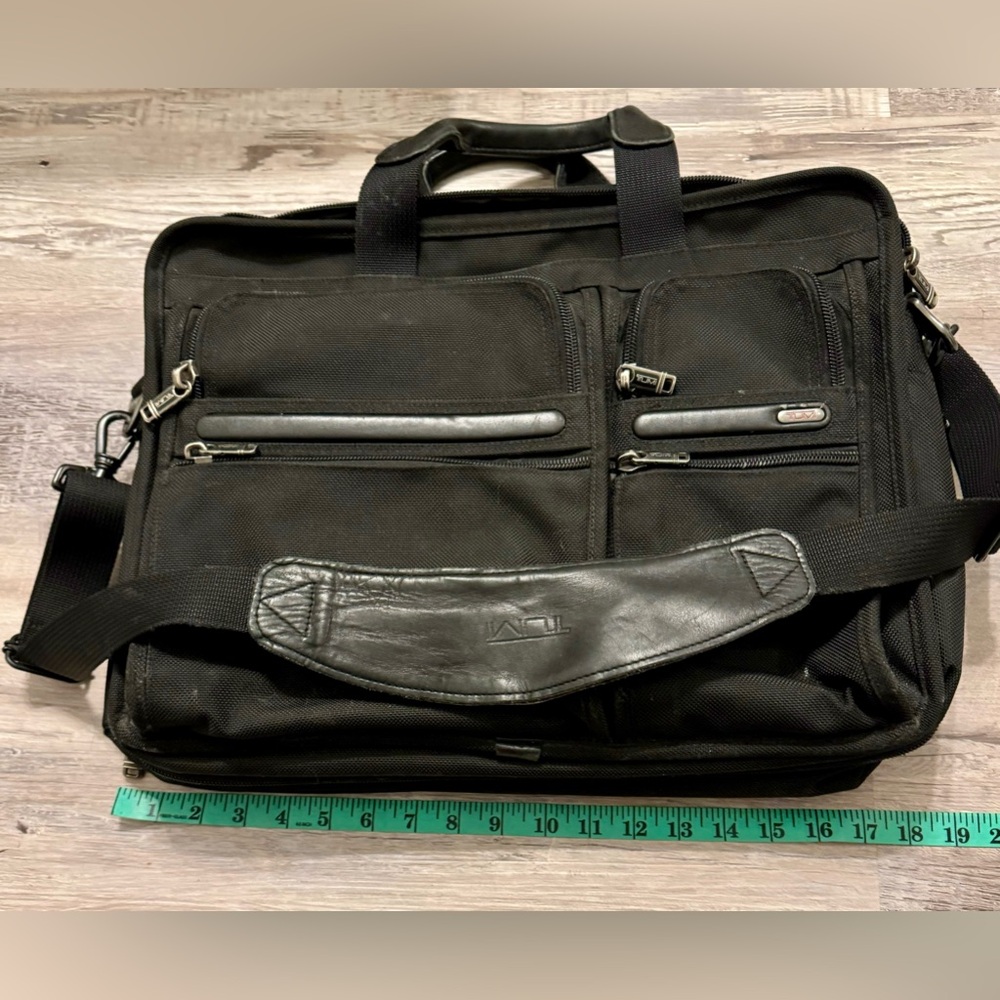 TUMI black laptop carrier bag. It has wallet inside.  It has various - Picture 15 of 15